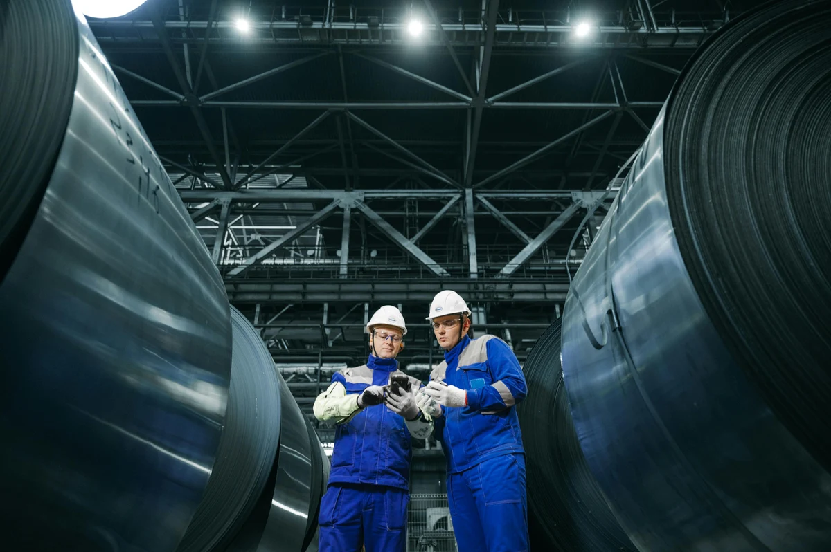Piping engineering trainees inspecting industrial pipelines