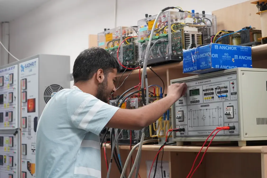 MEP engineering technician working with electrical equipment and control systems
